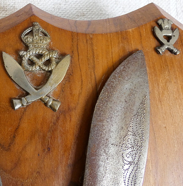 Two Gurka Kikri Knives Mounted Onto Shield Shaped Wooden Plate with Metal Cap Badges